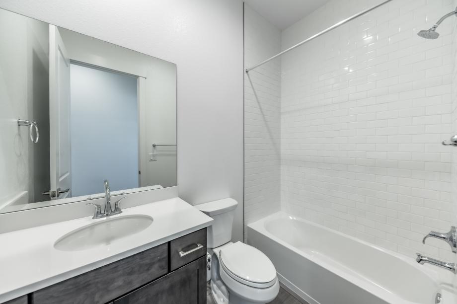 Secondary bathroom with a tub/shower combination