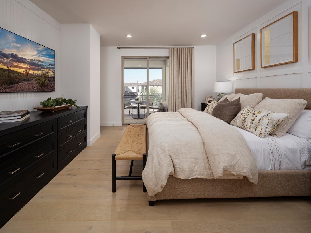 Stunning primary bedroom suite with beautiful flooring