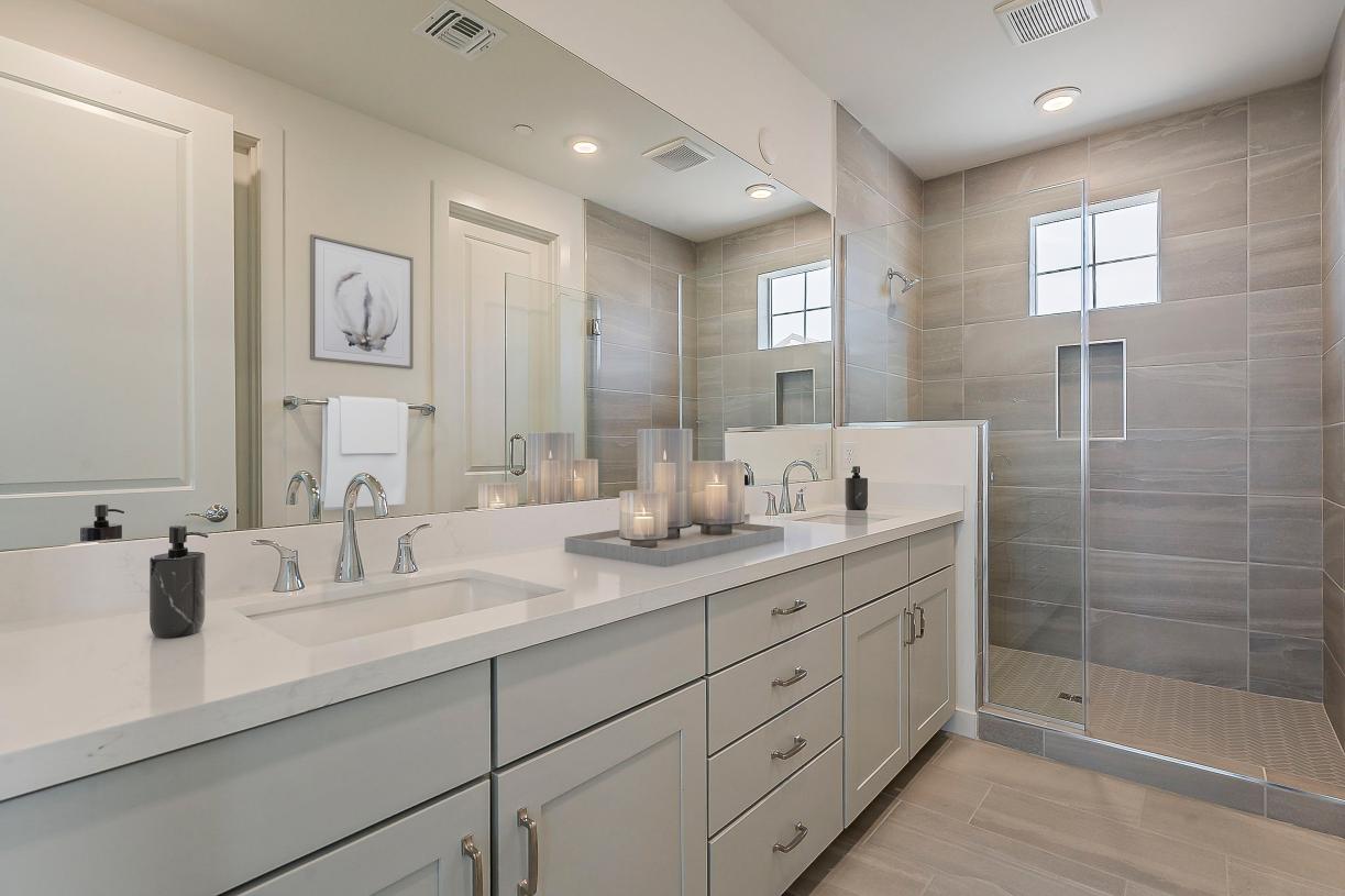 Primary bathroom with stunning glass shower and dual-sink vanity