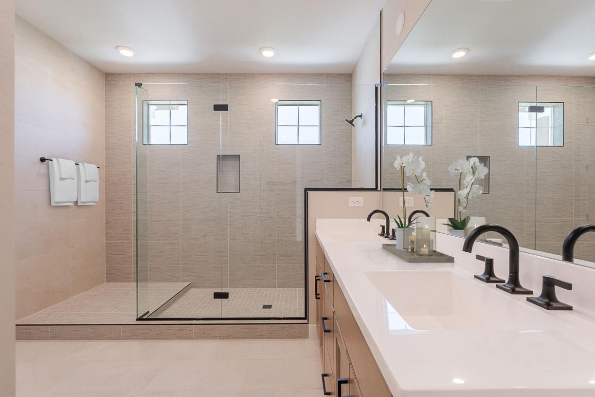 Gorgeous primary bathroom with dual-sink vanity and large walk-in glass shower