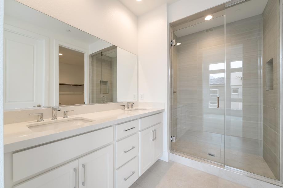 Stunning primary bath with upgraded shower tile surround