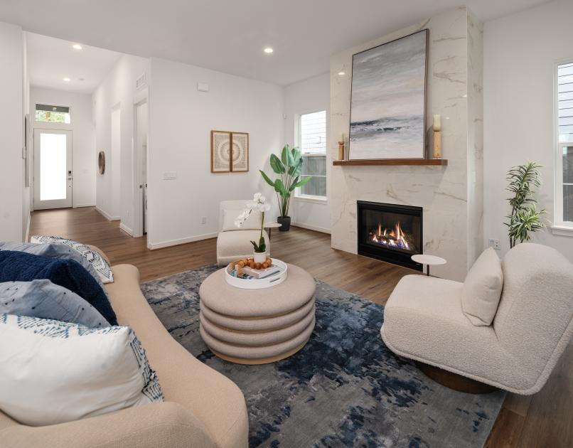 A gas fireplace with floor-to-ceiling tile is focal point of the great room