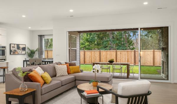 Great room with expansive stacking glass doors to covered patio