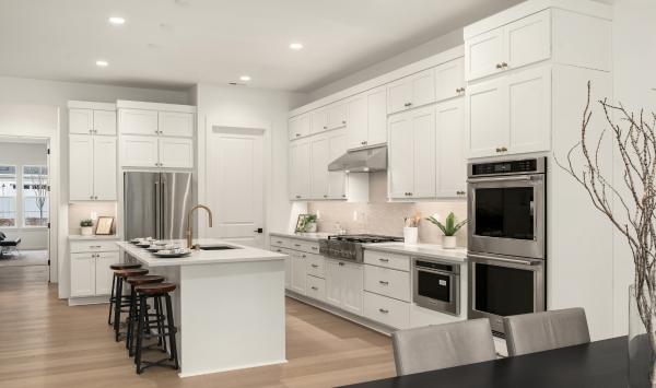 Spacious kitchen offers a large center island with breakfast bar seating