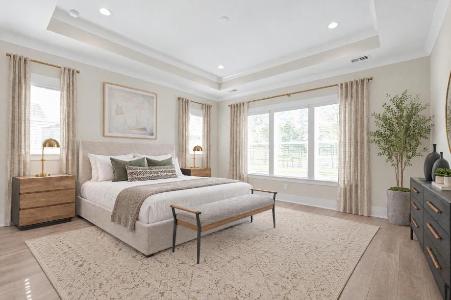 Luxurious first-floor primary bedroom suite