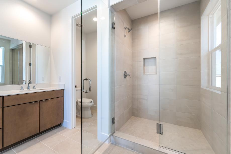 Luxe primary bath with tile surround shower