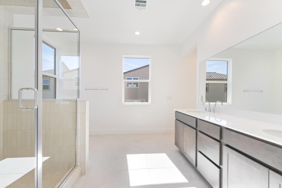 Luxe primary bath with tiled shower