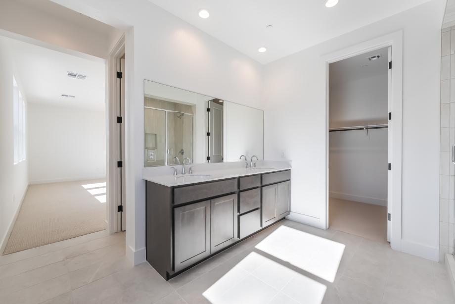 Primary bath features dual vanities