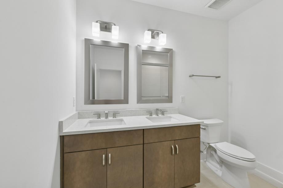 Secondary bathroom with a dual-sink vanity