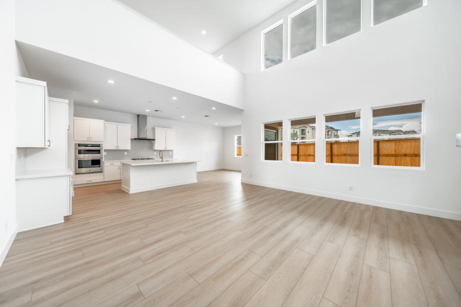 Open-concept floor plan with soaring high ceilings