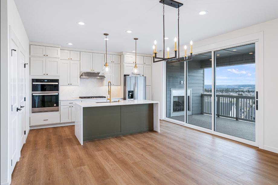 Multi-panel sliding glass doors open onto the covered deck