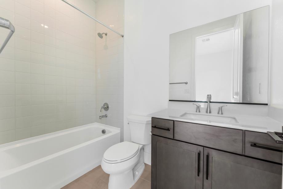 Lovely secondary bath with tile surround