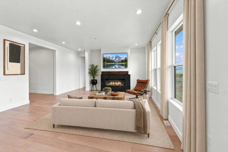 Great room with cozy fireplace and large windows