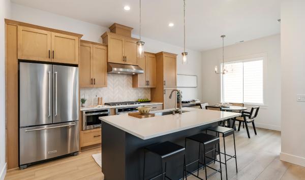 Well-designed kitchen offers a central island with breakfast bar