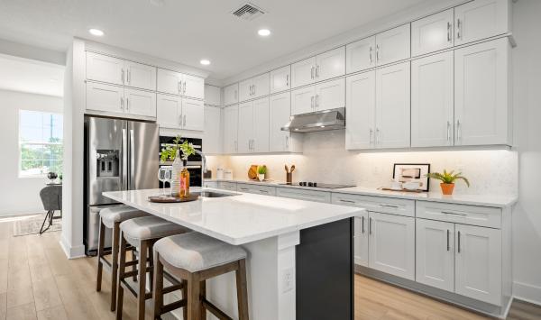 Gourmet kitchen with large center island and abundant storage