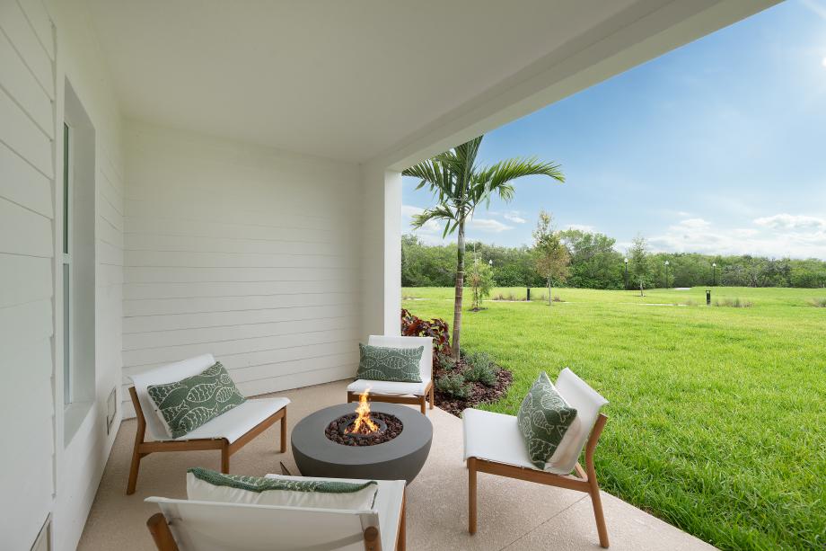 Breezy covered lanai with views of the community amenities and mangrove trees