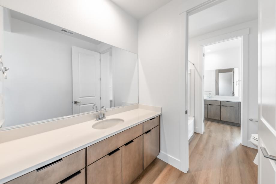 Secondary bathroom with a dual-sink vanity