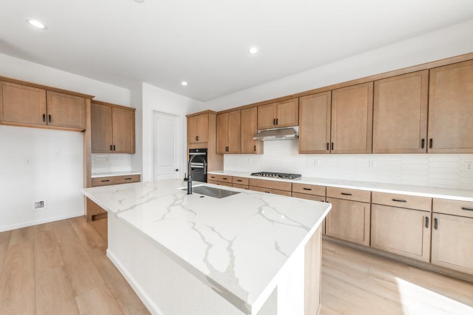 Well-equipped kitchen with stainless steel appliances and a large center island