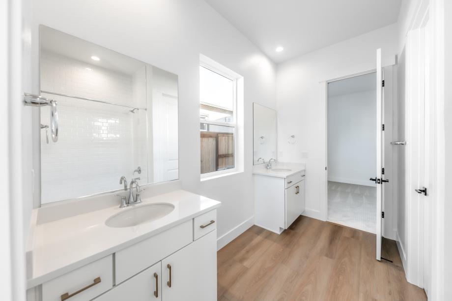 Secondary bathroom with a dual-sink vanity