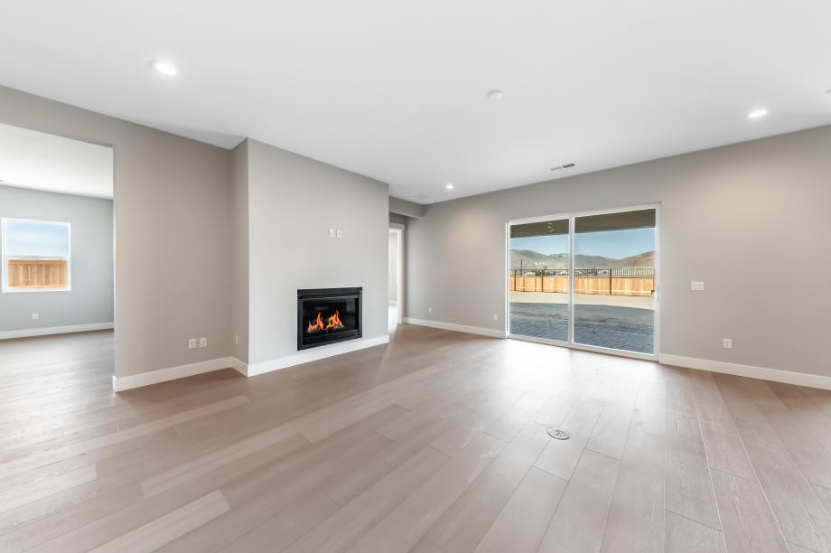 Cozy fireplace in the great room with a sliding-glass door