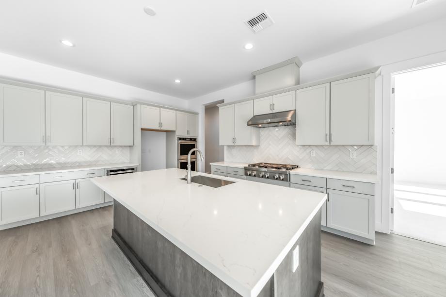 Well-equipped kitchen with beautiful cabinets and ample countertop space