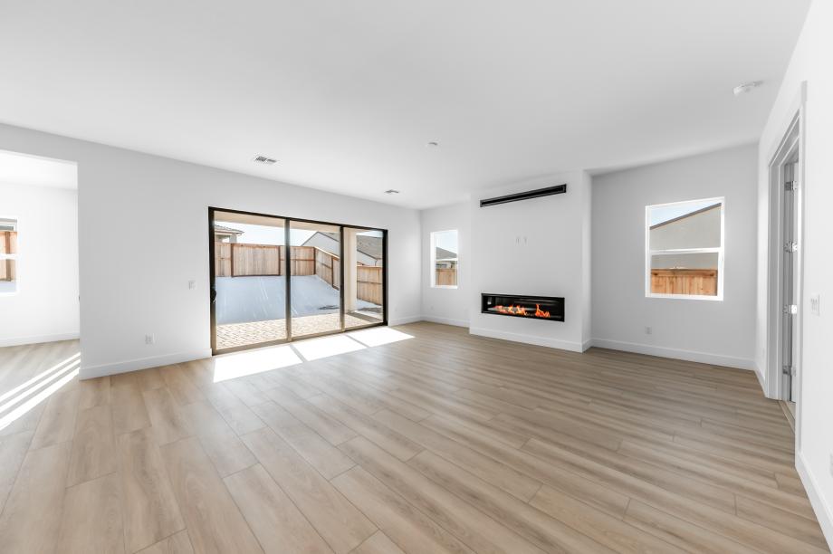 Cozy great room with a fireplace and ample natural light