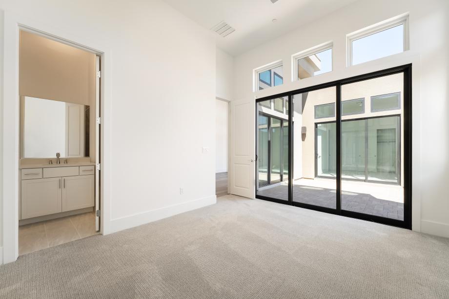 The third and fourth bedrooms open to a private interior courtyard