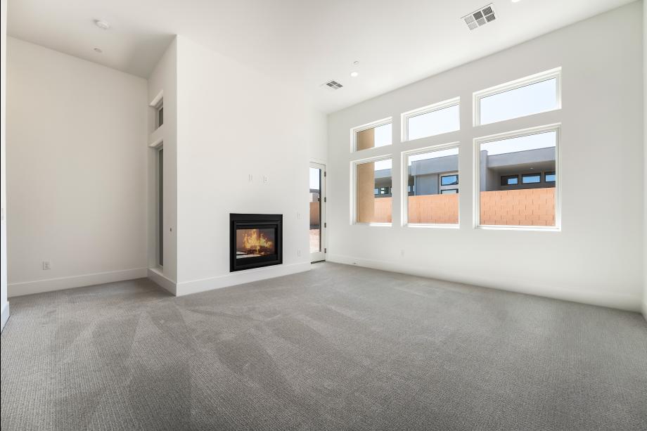Expansive primary bedroom suite with 2-way fireplace