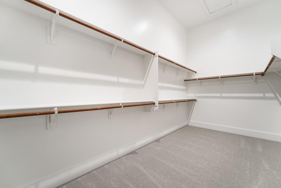 Large walk-in primary closet for all of your favorite things