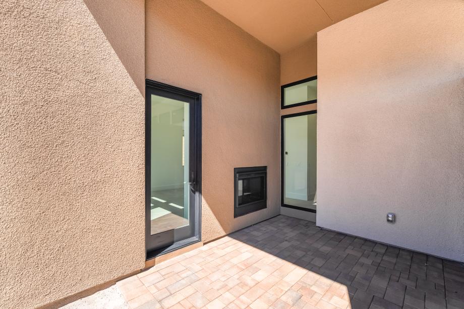 Primary bedroom has its own patio space
