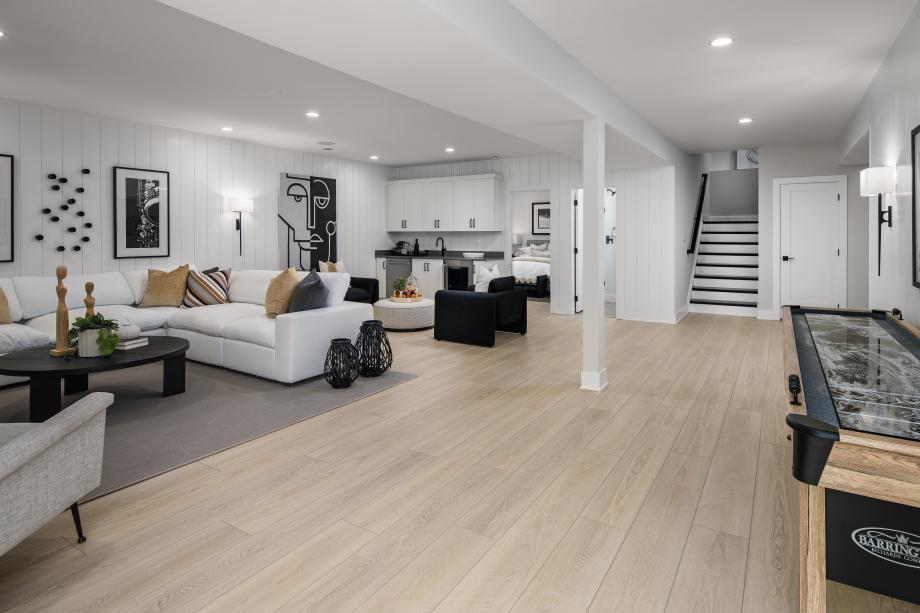 Finished basement with wet bar, bedroom, and bathroom