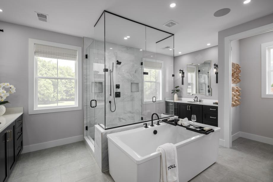 Luxurious primary bathroom with freestanding tub and large shower
