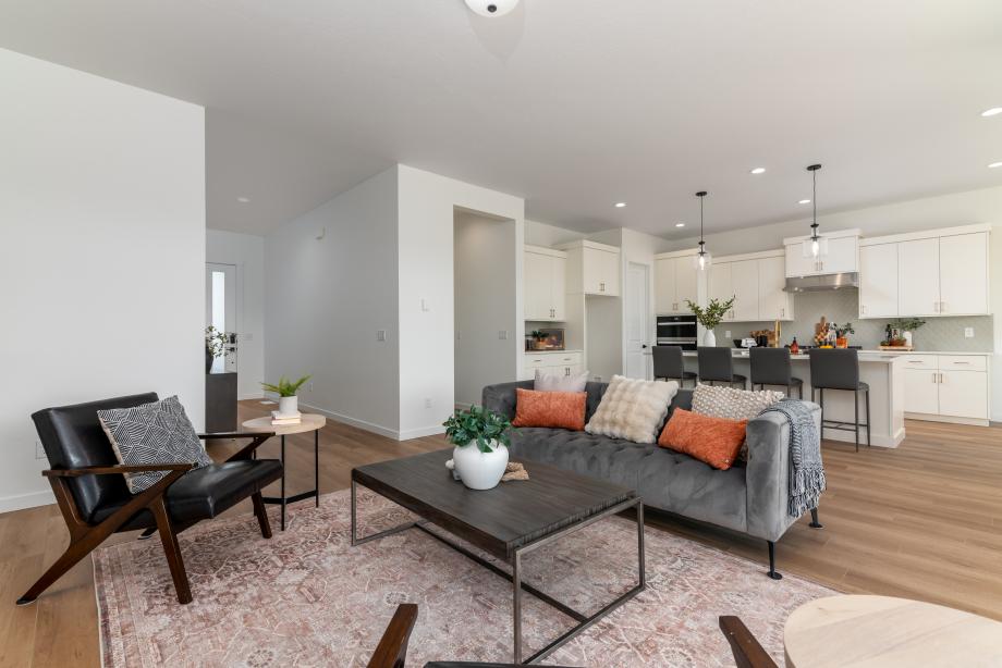 Open great room seamlessly connects to the kitchen and dining areas