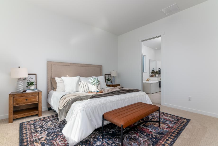 Primary bedroom suite offering a serene retreat with abundant natural light