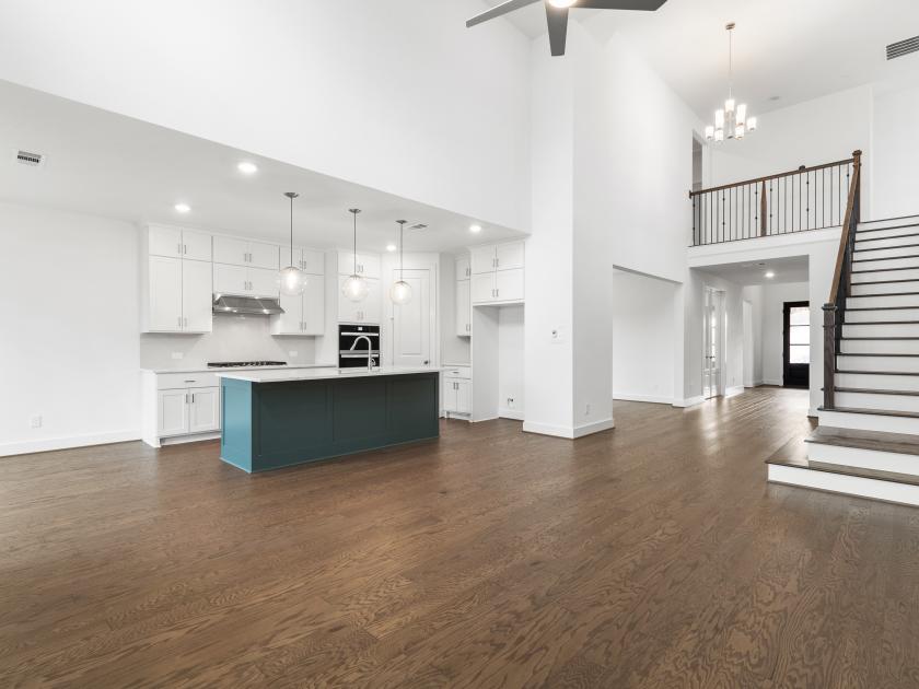 Kitchen with a view of the great room and high ceilings
