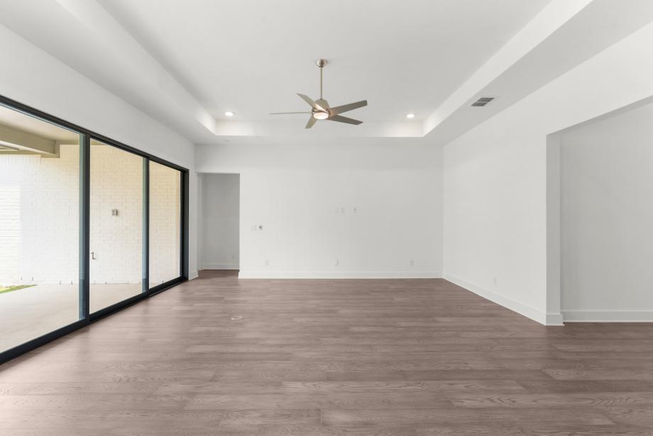 Expansive great room with multi-stack sliding doors that open up to your outdoor oasis