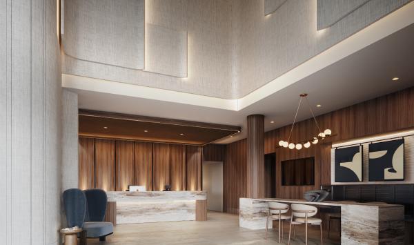 The double height lobby with inviting reception area offers a warm welcome to residents and their guests