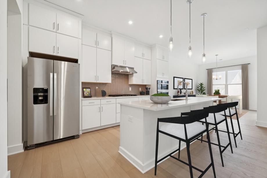 Spacious kitchen with ample cabinet storage and kitchen appliances