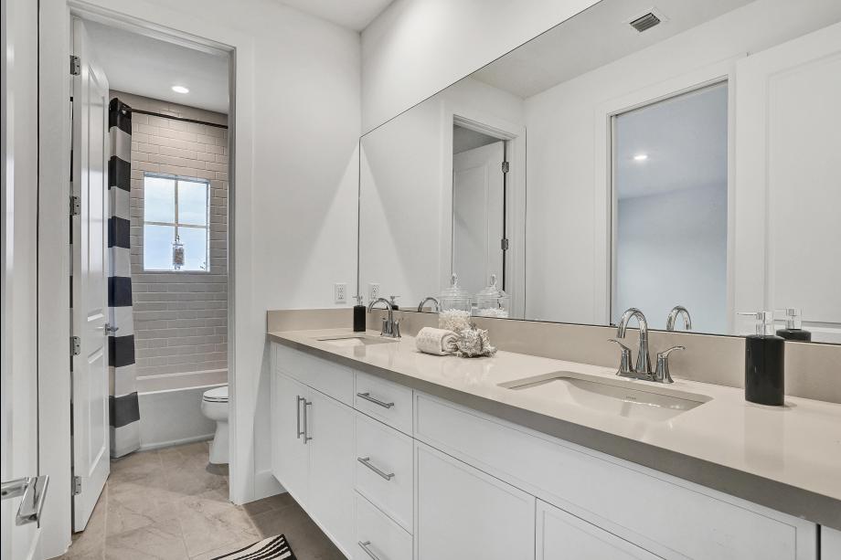 Thoughtfully appointed guest bath with stylish fixtures and finishes