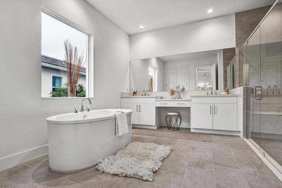 Spa-style primary bath with refined materials and a serene ambiance
