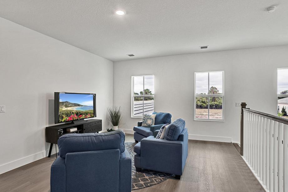 Versatile loft ideal for lounging, media, or additional living space