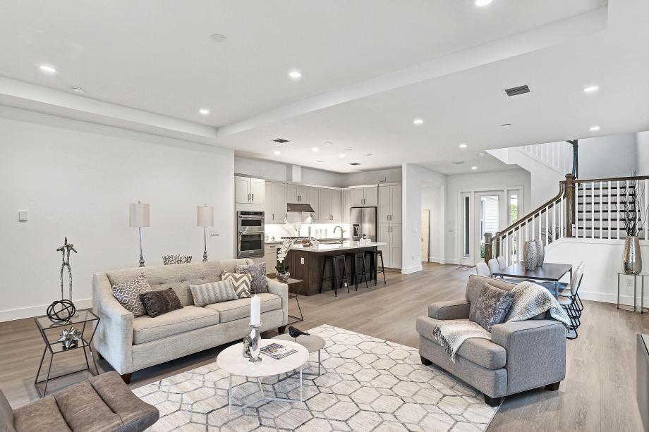 Open-concept living area connecting kitchen, dining, and gathering spaces