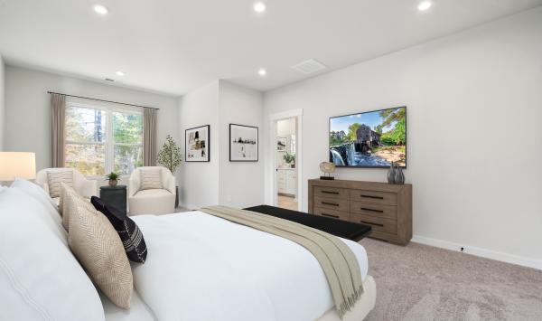 Serene primary bedroom with seating area