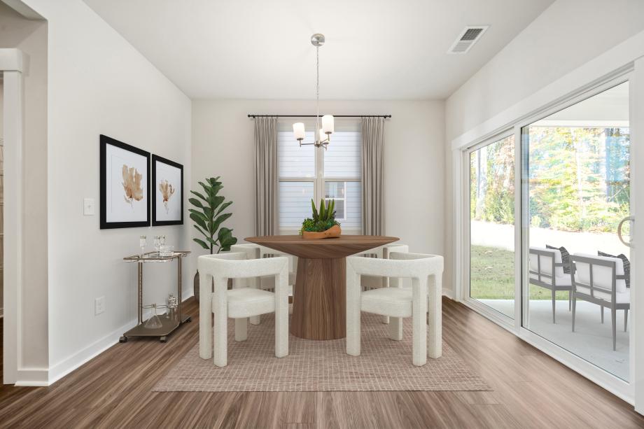 Intimate causal dining area with view of private backyard