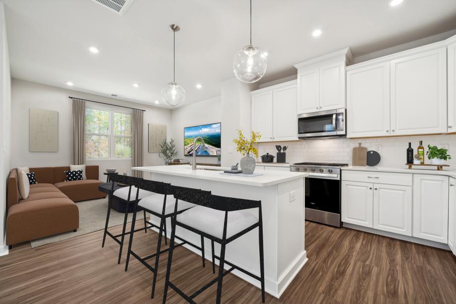 Gorgeous kitchen with quartz countertops and white cabinetry