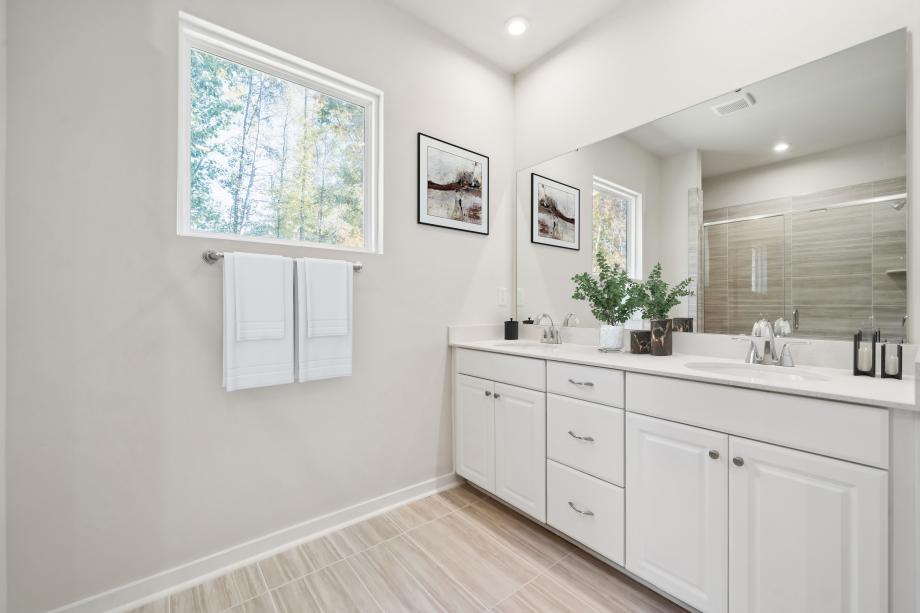 Serene primary bathroom with dual sinks