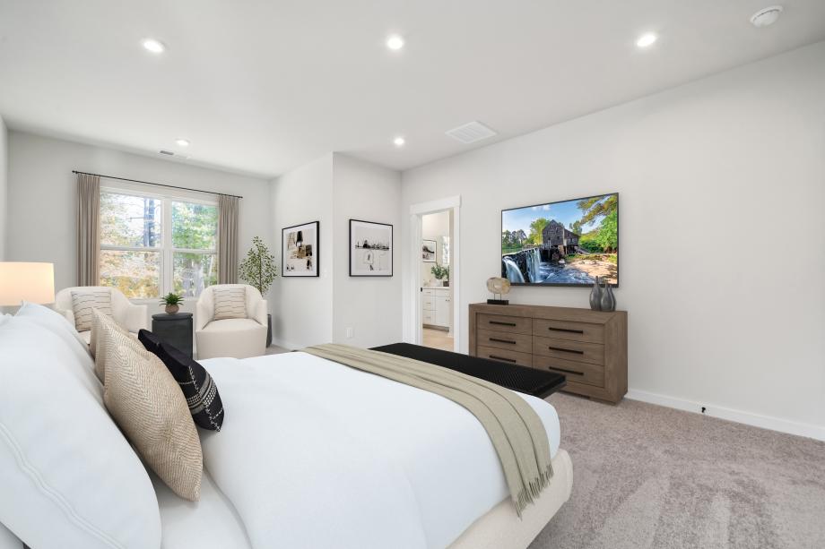 Secluded primary bedroom with seating area