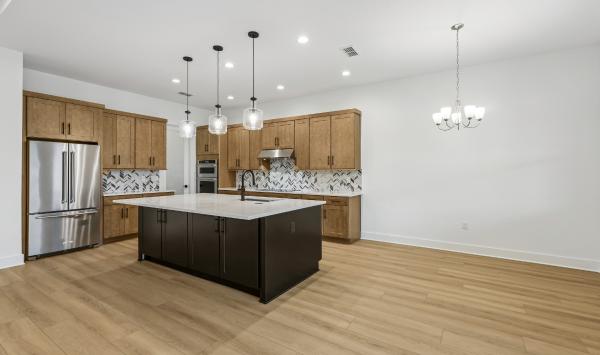 Gather round, entertain, and relax in a grand, light-filled space designed for connection