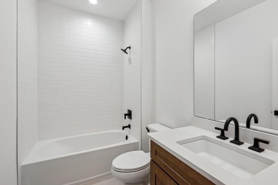 Fresh, clean, and effortlessly modern secondary bathroom