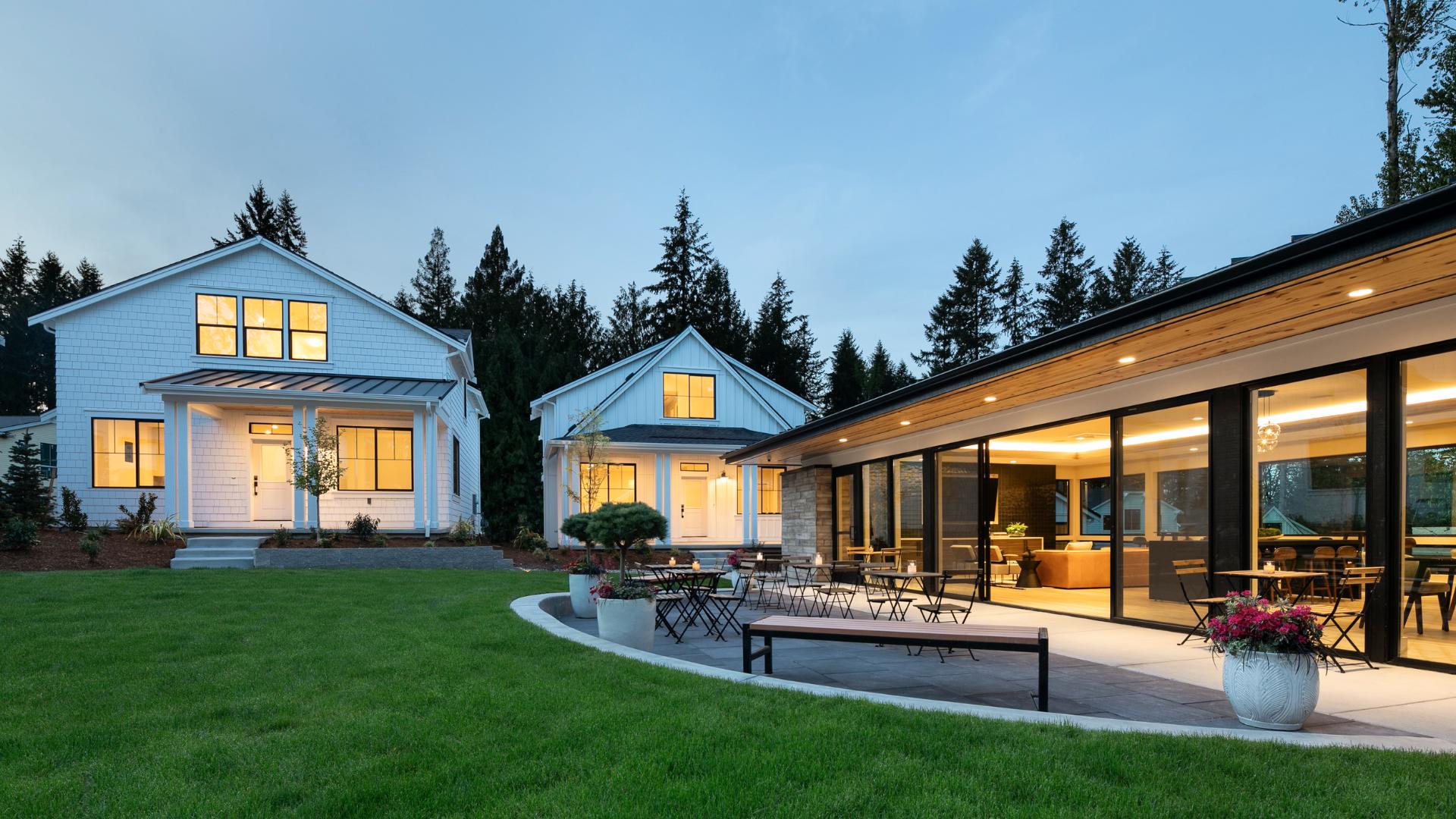 The modern community clubhouse and contrasts with the cottages in a striking white palette